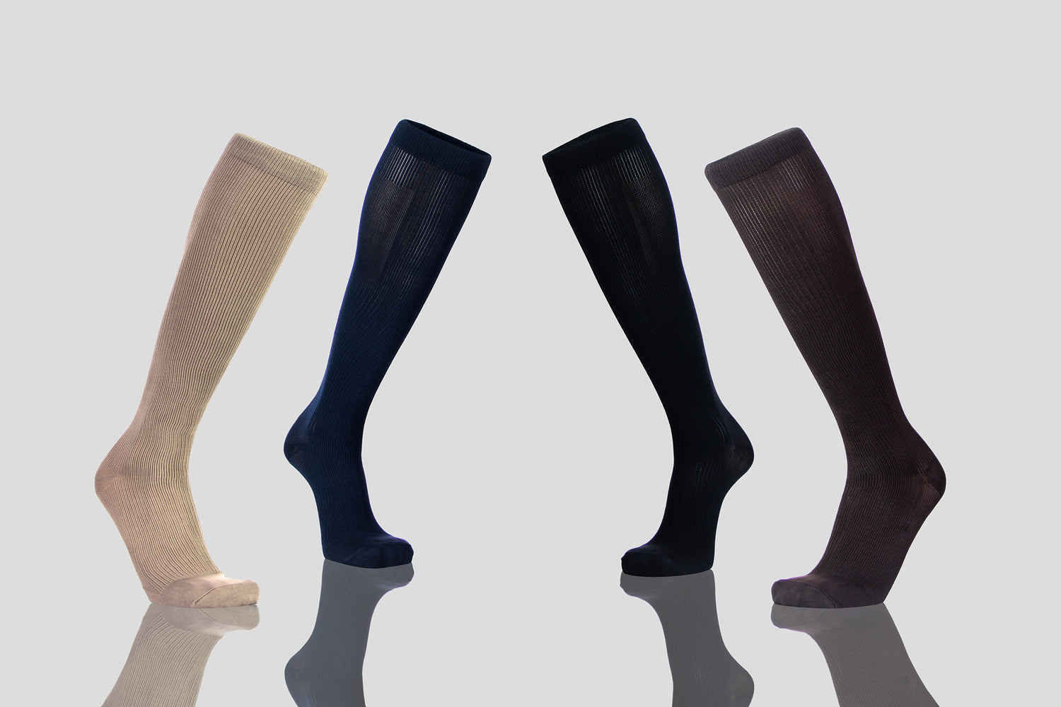 Image Showing Compression Socks In 4 Colors With Thick Fabric - Light Grey Background With Shadow